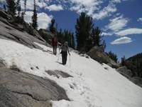Crossing a snowfield in the cirque. (Category:  Rock Climbing)