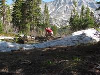 Mike building a bridge across the creek. (Category:  Rock Climbing)