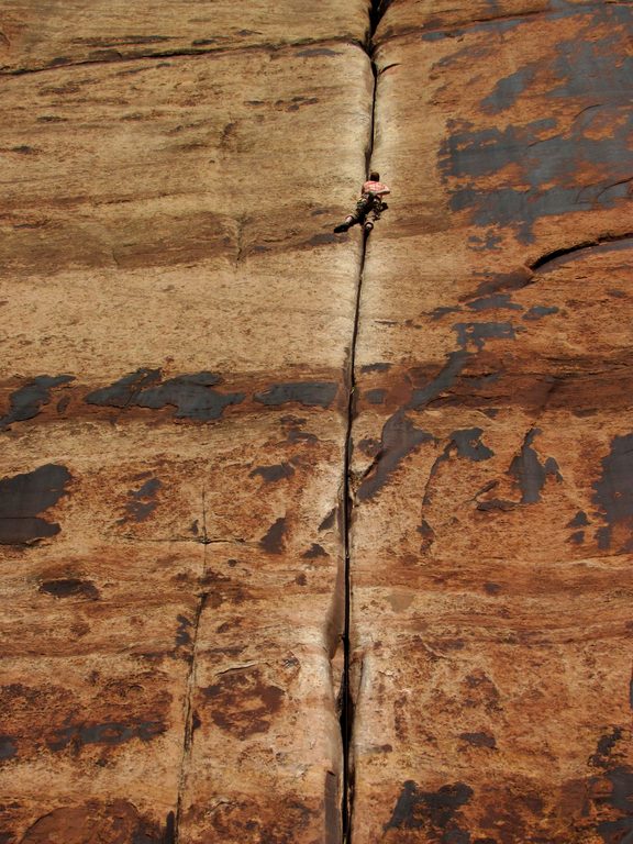 Guy leading Generic Crack. (Category:  Rock Climbing)
