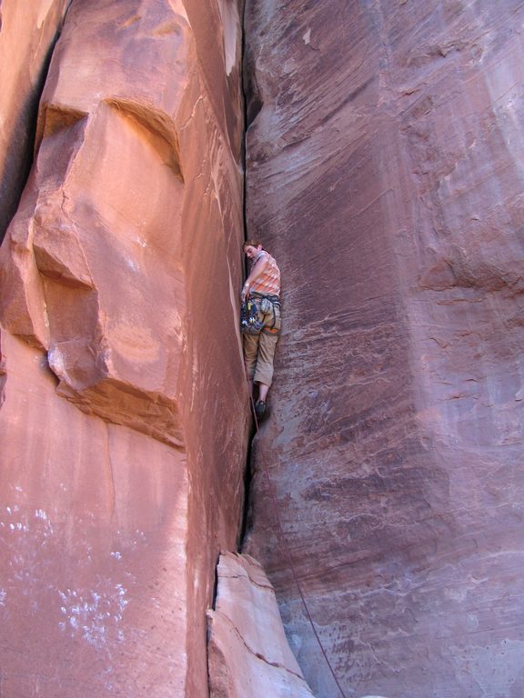 Guy leading Drain Pipe. (Category:  Rock Climbing)