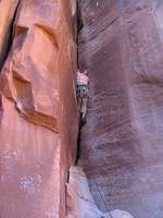 Guy leading Drain Pipe. (Category:  Rock Climbing)