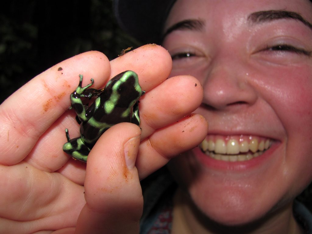 Tara holding a Black and Green Dart Frog. (Category:  Travel)