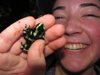 Tara holding a Black and Green Dart Frog. (Category:  Travel)