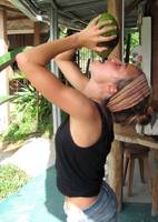 Leona drinking coconut water. (Category:  Travel)