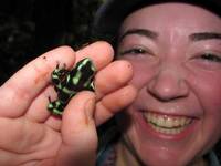 Tara holding a Black and Green Dart Frog. (Category:  Travel)