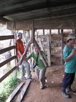 Laetitia grinding sugar cane. (Category:  Travel)