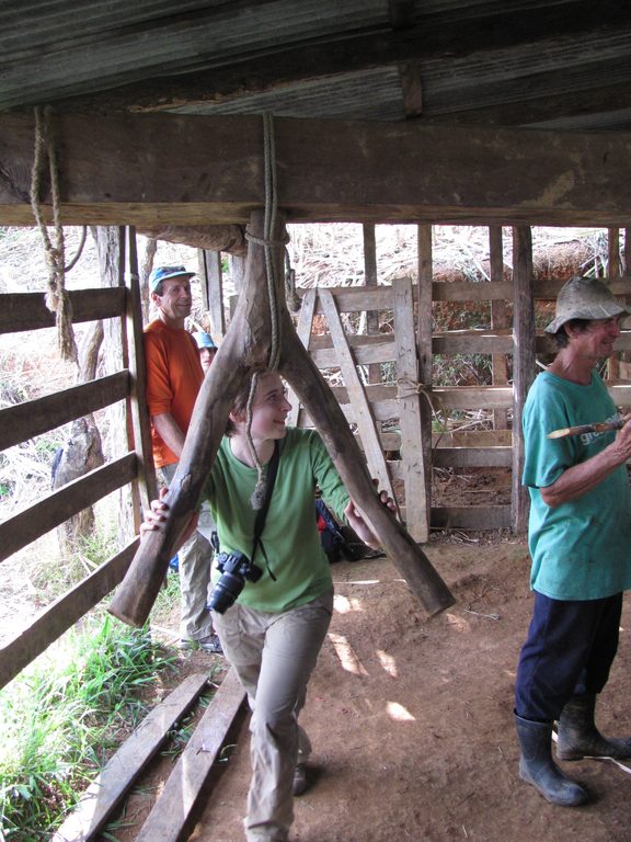 Laetitia grinding sugar cane. (Category:  Travel)