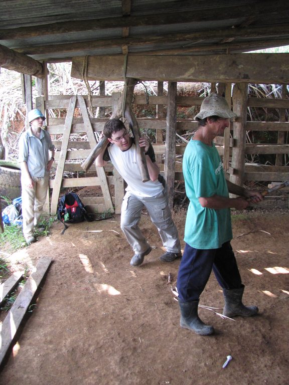 Andrew grinding sugar cane. (Category:  Travel)