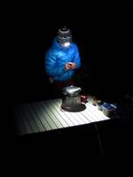 Nico cooking dinner on her new roll-up table. (Category:  Rock Climbing)