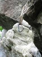 Trad draw to get the biner off an edge. (Category:  Rock Climbing)