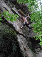 Yamin getting brown sticky stuff on his shoes. (Category:  Rock Climbing)