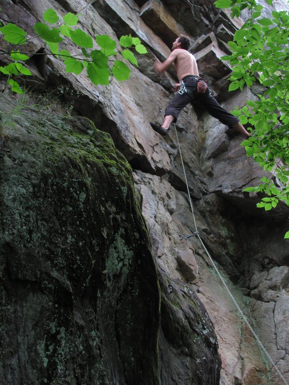 Yamin getting brown sticky stuff on his shoes. (Category:  Rock Climbing)