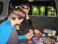 Playing Pandemic in the truck.  In the fucking rain. (Category:  Rock Climbing)