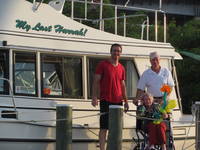 Posing by the boat. (Category:  Family)