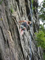 That blue rope is her climbing rope. (Category:  Rock Climbing)