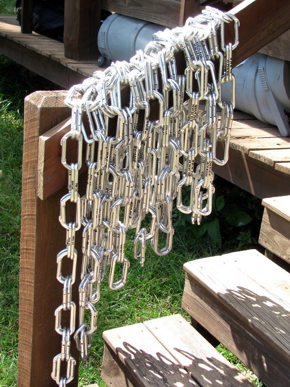 Some 800 oval biners will be placed at the top of routes so climbers can lower instead of clean. (Category:  Rock Climbing)