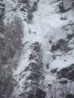 Tammy leading the first pitch of Chouinard's Gully in the middle of a winter storm. (Category:  Ice Climbing)