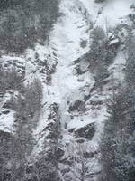 Tammy leading the first pitch of Chouinard's Gully in the middle of a winter storm. (Category:  Ice Climbing)