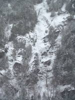 Tammy leading the first pitch of Chouinard's Gully in the middle of a winter storm. (Category:  Ice Climbing)