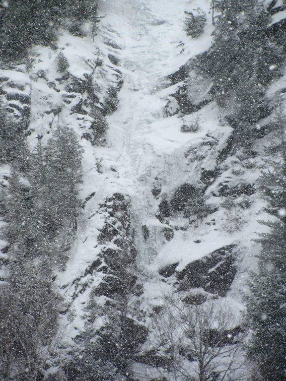 Tammy leading the first pitch of Chouinard's Gully in the middle of a winter storm. (Category:  Ice Climbing)