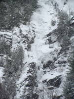 Tammy leading the first pitch of Chouinard's Gully in the middle of a winter storm. (Category:  Ice Climbing)