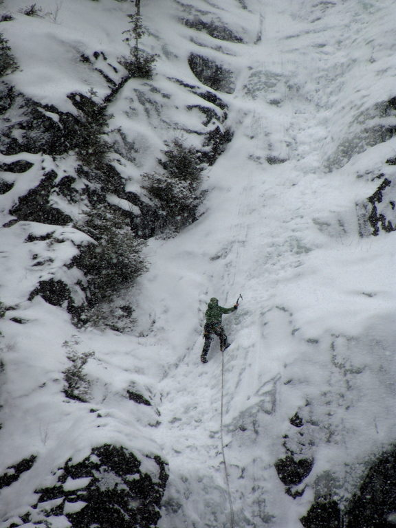 Tammy leading the first pitch of Chouinard's Gully in the middle of a winter storm. (Category:  Ice Climbing)