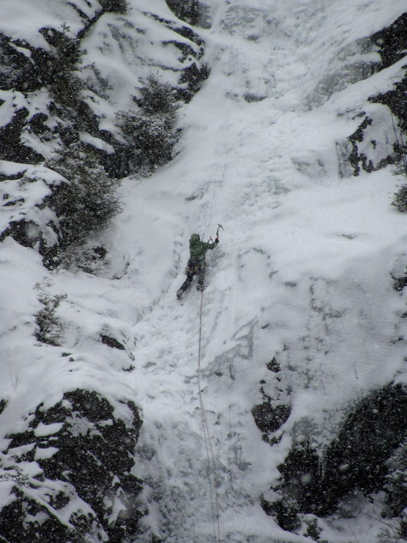 Tammy leading the first pitch of Chouinard's Gully in the middle of a winter storm. (Category:  Ice Climbing)