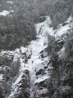 Tammy leading the first pitch of Chouinard's Gully in the middle of a winter storm. (Category:  Ice Climbing)