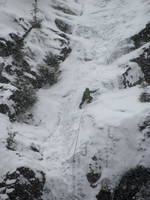 Tammy leading the first pitch of Chouinard's Gully in the middle of a winter storm. (Category:  Ice Climbing)