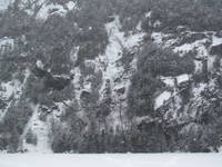 Tammy leading the first pitch of Chouinard's Gully in the middle of a winter storm. (Category:  Ice Climbing)