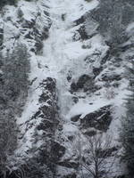 Tammy leading the first pitch of Chouinard's Gully in the middle of a winter storm. (Category:  Ice Climbing)