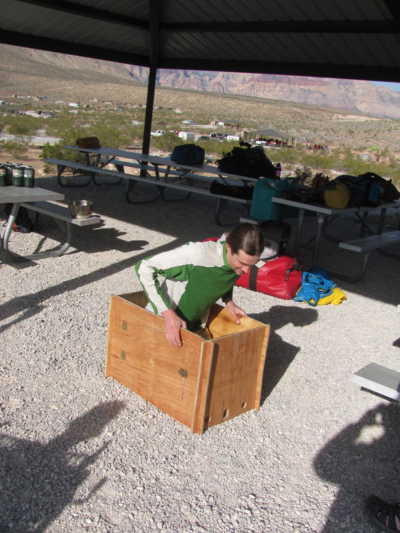 Andrew demonstrating how he stays out of the wind. (Category:  Rock Climbing)