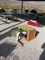 Andrew demonstrating how he stays out of the wind. (Category:  Rock Climbing)