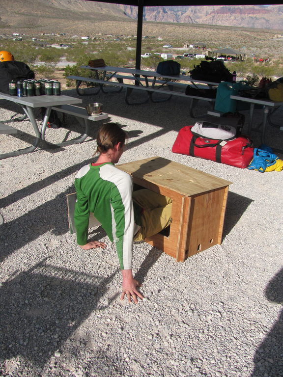 Andrew demonstrating how he stays out of the wind. (Category:  Rock Climbing)