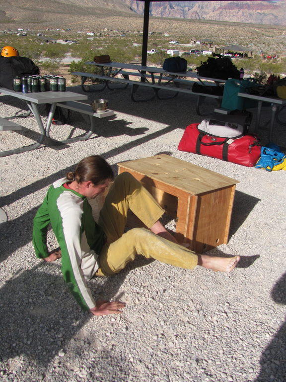 Andrew demonstrating how he stays out of the wind. (Category:  Rock Climbing)