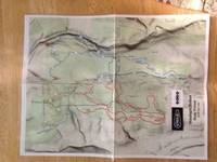 A lousy photo of Anna's copy of the latest map. (Category:  Biking)