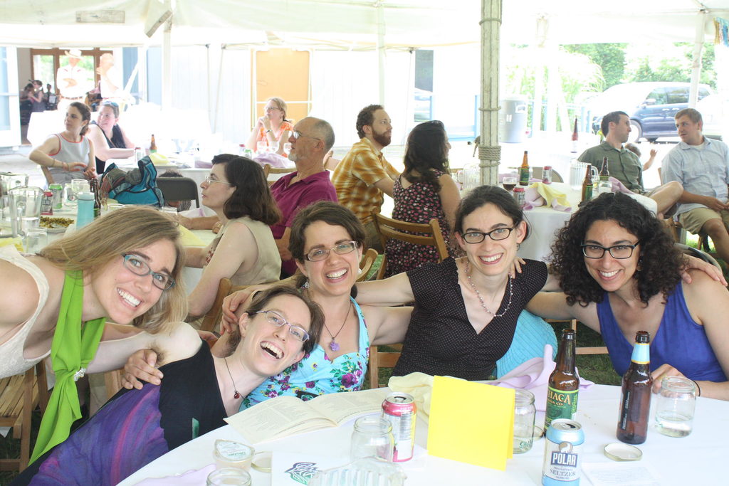 Agusta, Sara, Rebecca, Molly, and Darya pay more attention to the camera than to the book. (Category:  Party)