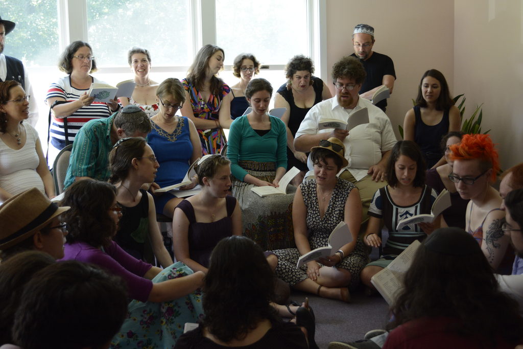 At the same time, Annie prepared for the ceremony at her tisch, a song circle led by Talia and Annie's mother Carole. (Category:  Party)