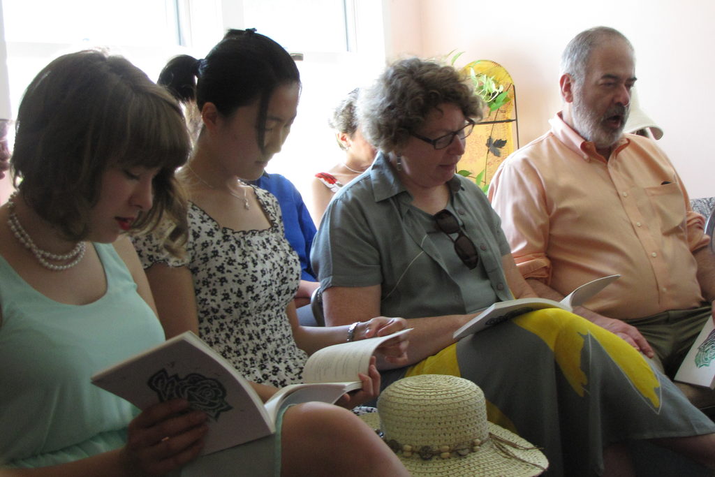 Sarah, Zhen, and Ina read along. Jay yawned. (Category:  Party)