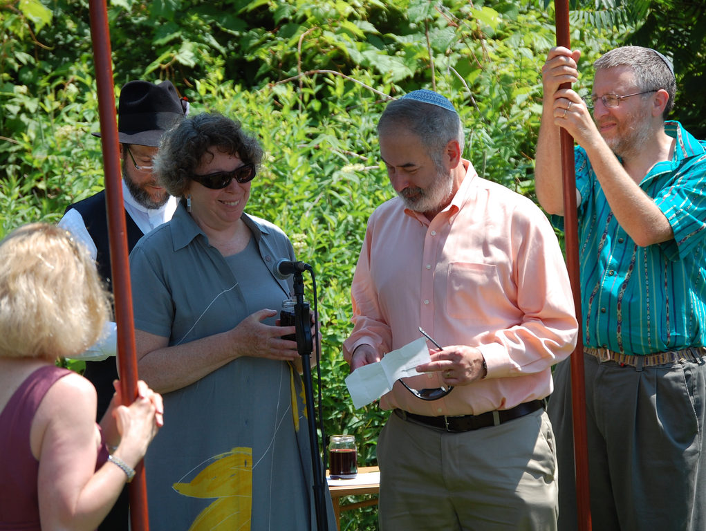 Ina and Jay read the first blessing. (Category:  Party)