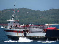 Ferry going back to Vieques with carnival trucks for the big festival next week. (Category:  Family)