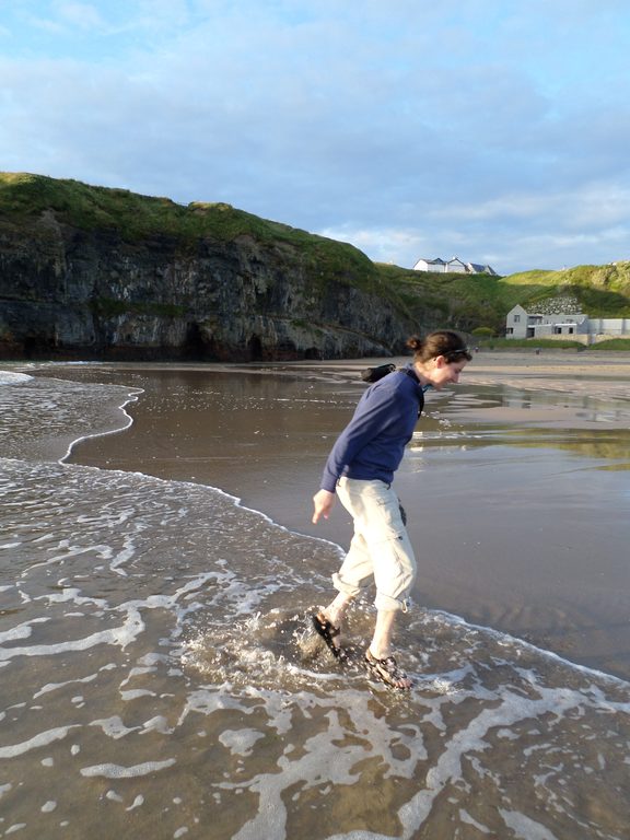 Marissa did venture to dip her toes in the water, but true to form, hopped like a sandpiper each time a wave came in, as though she couldn't have expected that to happen (Category:  Travel)