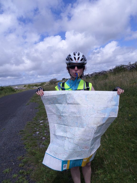 Marissa hydrated while helping with the challenging task of refolding the map in the wind (Category:  Travel)