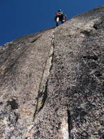 Phil leading the crux of West Face of North Early Winter Spire. (Category:  Rock Climbing)
