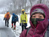 Me, Jackie, George and Cathy during a very blustery hike out (Category:  Ice Climbing)