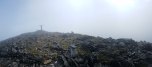 Jackie on the summit of Hallett. You can't see all of Hallett in this view. Just the tip. (Category:  Rock Climbing)