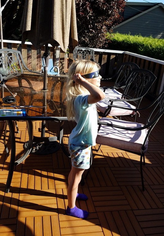 Joni watching the eclipse (Category:  Rock Climbing)