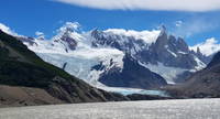 Laguna Torre with Cerro Torre, Torre Egger, and Aguja Standhardt behind and to the right. Centered in the foreground are the Adela mountains. (Category:  Backpacking)