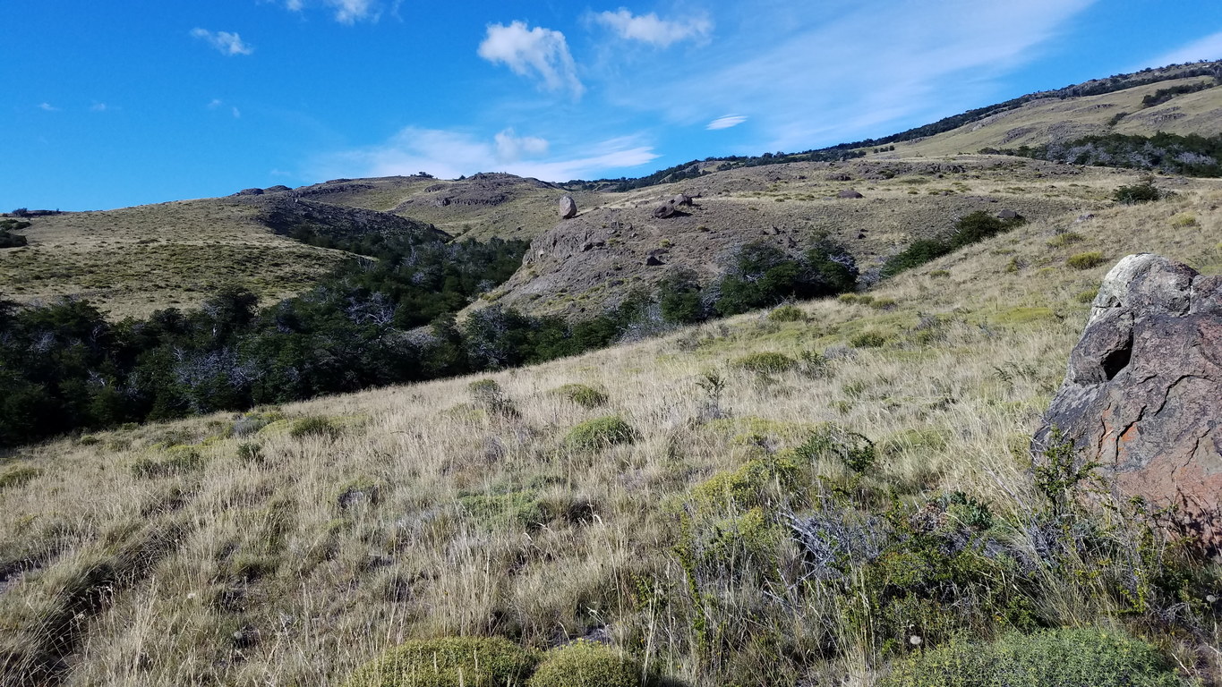 Looks like someone could push that boulder right off the hill (Category:  Backpacking)