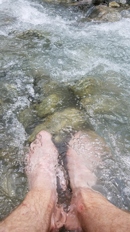 Soaking my sore feet in the frigid river (Category:  Climbing)